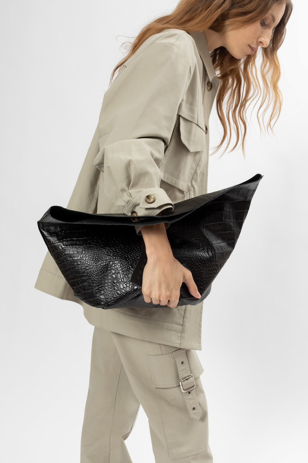 Hand Matters. Black reptile leather bag