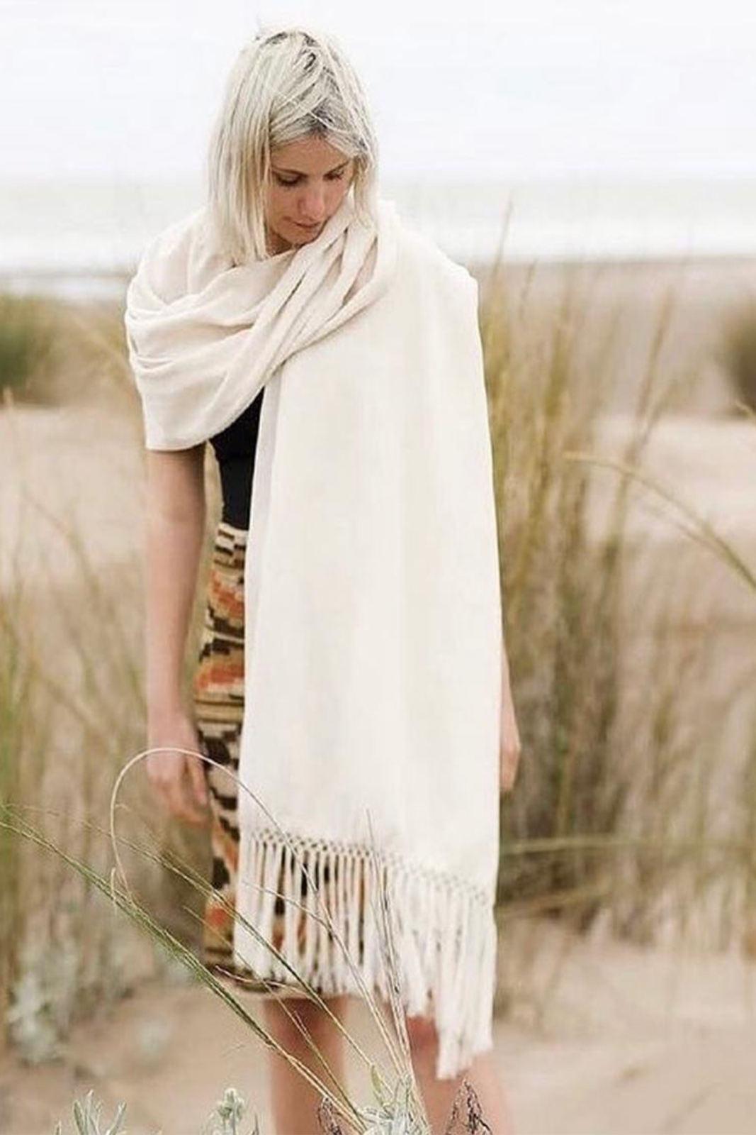 Hand Matters. Styling white llama shawl in the beach