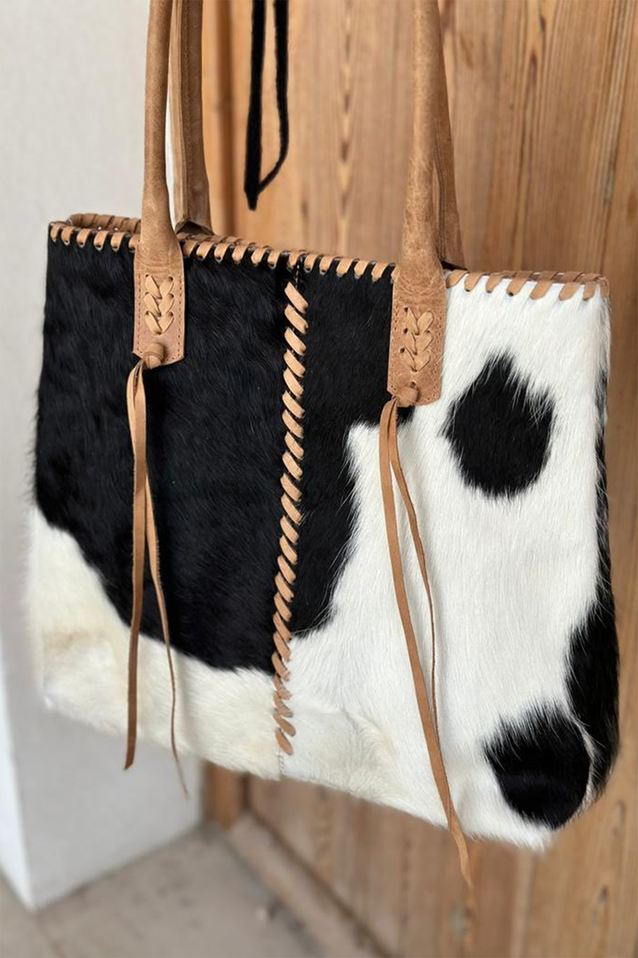 Hand Matters. Black and White cow feather purse